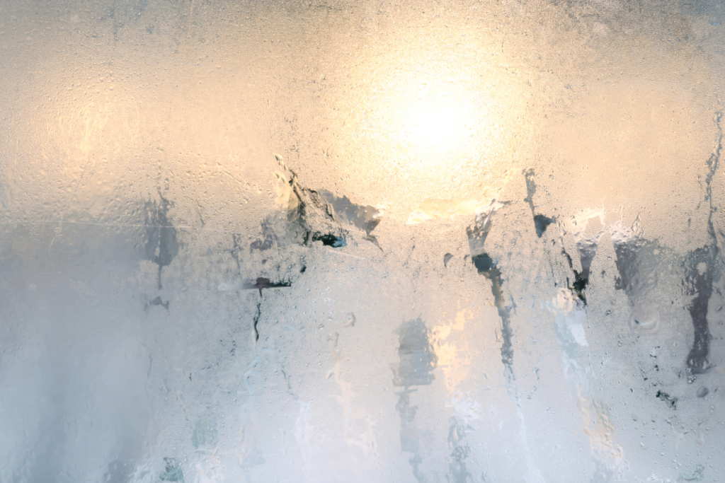 Foggy window from high humidity in house with the AC running – air conditioning Gold Coast humidity control problem.