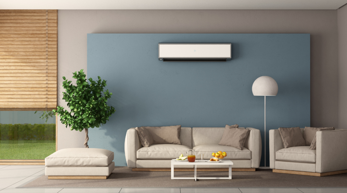 Modern living room with wall-mounted split air conditioner showing how your AC is working harder than it needs to during season change, common in residential air conditioning Gold Coast homes.
