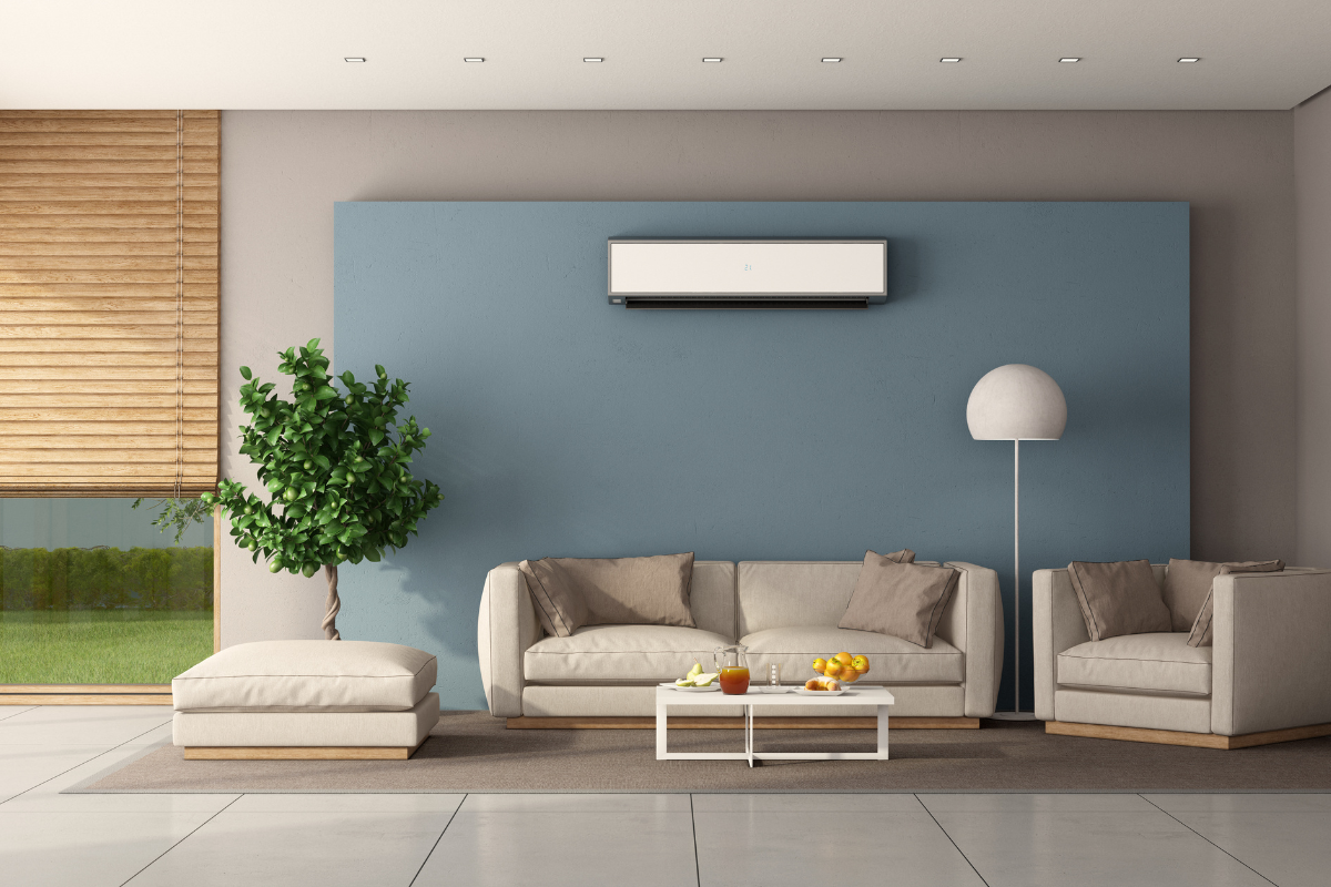 Modern living room with wall-mounted split air conditioner showing how your AC is working harder than it needs to during season change, common in residential air conditioning Gold Coast homes.