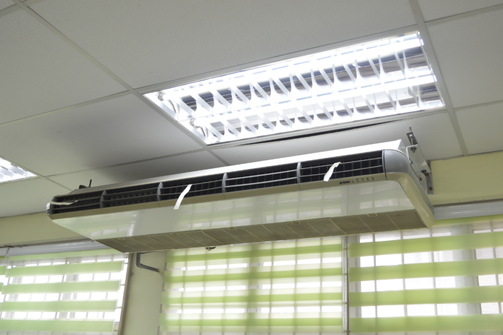 A ceiling-mounted unit for commercial air conditioning Gold Coast, providing a powerful solution when deciding whether to run aircon or dehumidifier to manage high humidity.