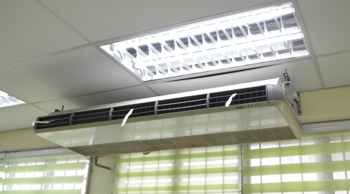 A ceiling-mounted unit for commercial air conditioning Gold Coast, providing a powerful solution when deciding whether to run aircon or dehumidifier to manage high humidity.