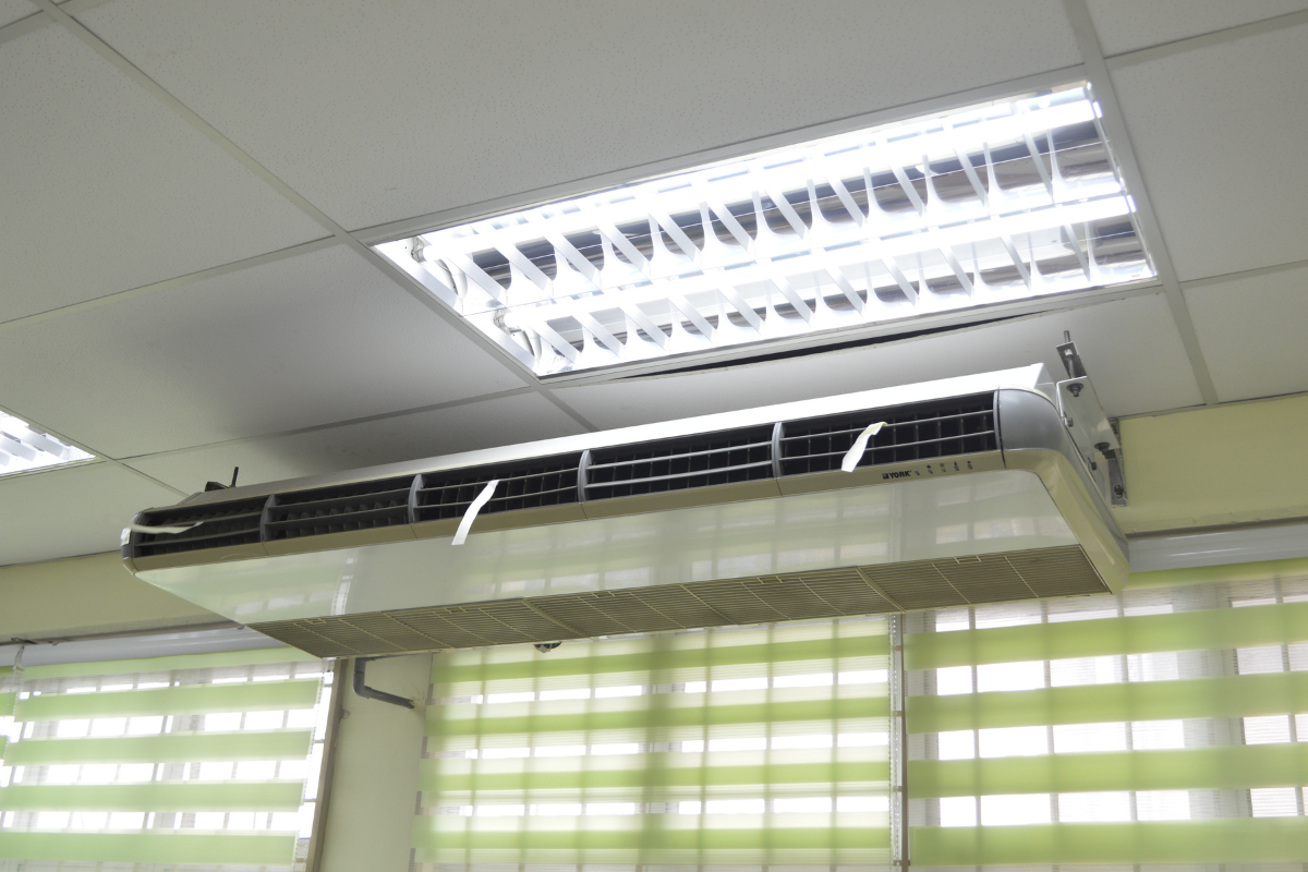 A ceiling-mounted unit for commercial air conditioning Gold Coast, providing a powerful solution when deciding whether to run aircon or dehumidifier to manage high humidity.