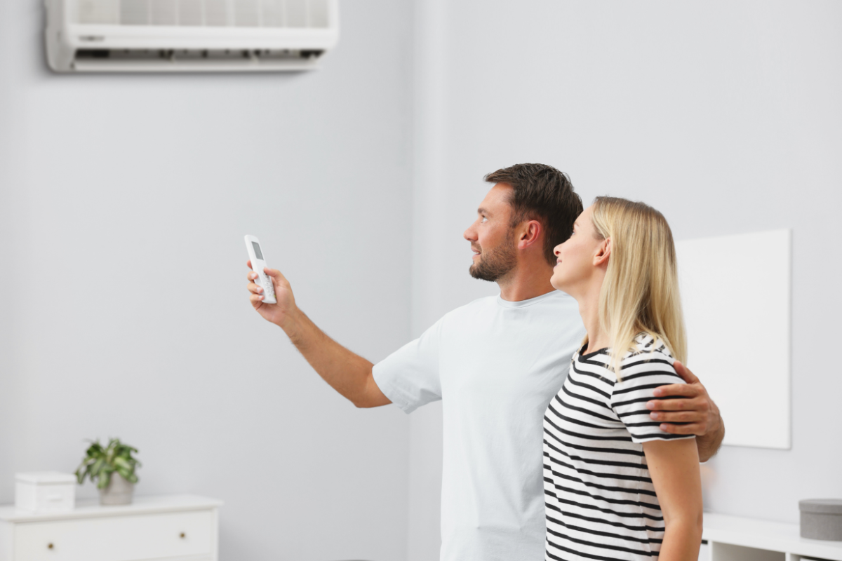 A happy couple enjoying the benefits of Panasonic Humidity Sensor Tech through their residential air conditioning Gold Coast installation.
