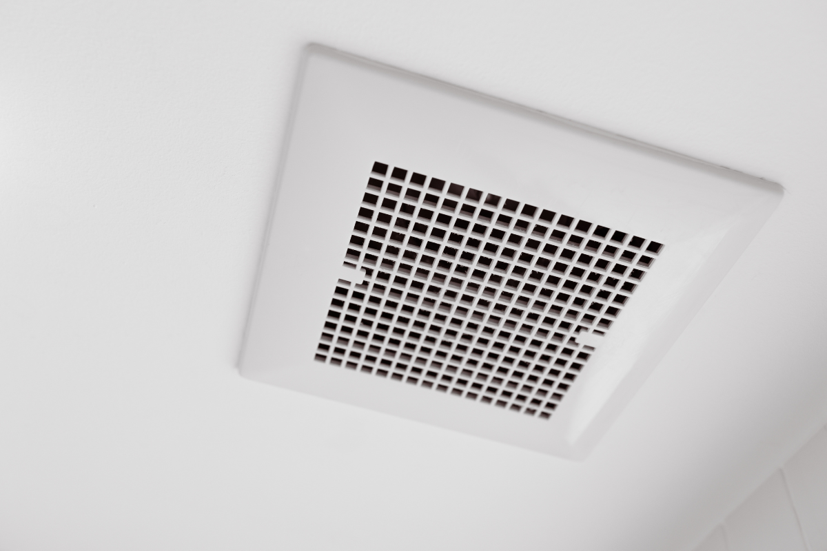 A square ceiling vent grille, typical in commercial air conditioning Gold Coast systems designed to help the aircon dehumidify large office spaces.