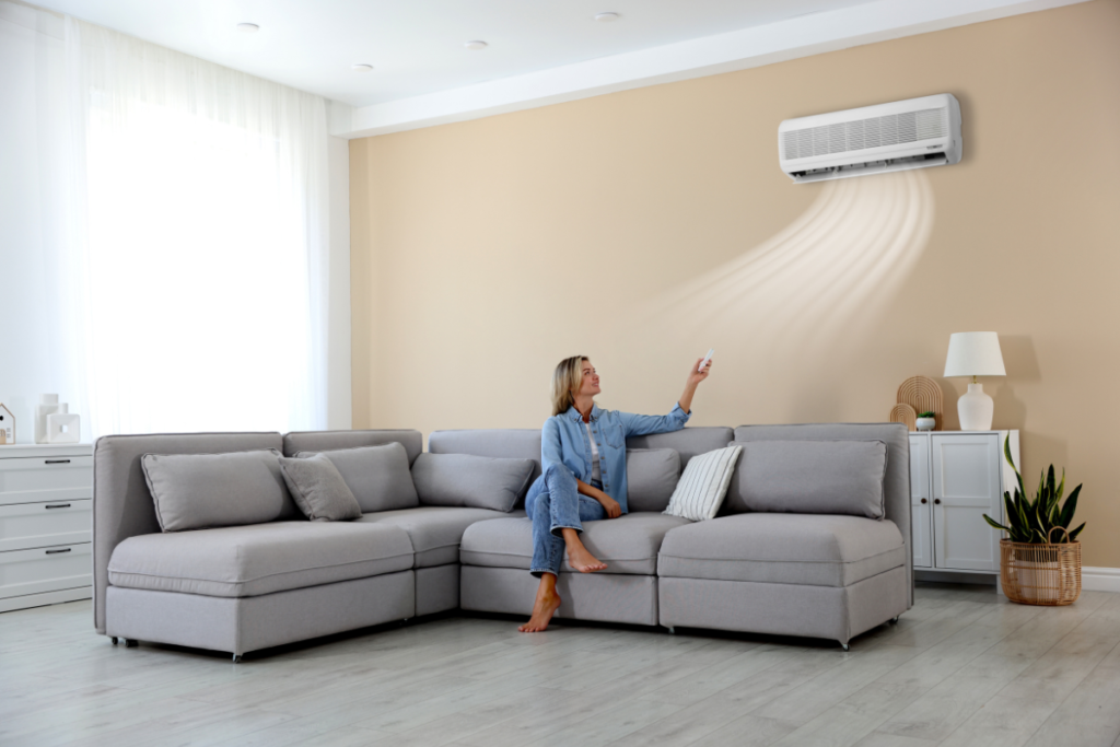 A sleek indoor wall-mounted unit on an exposed brick wall, utilizing Fujitsu Heat Mode for optimal air conditioning Gold Coast comfort.