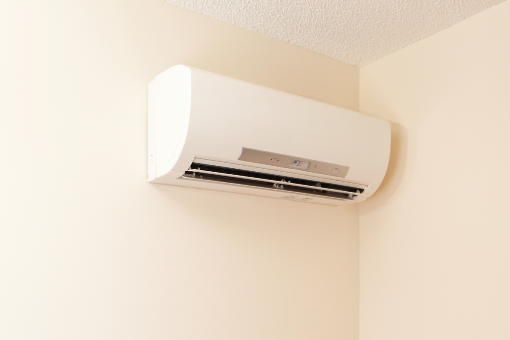 A sleek white LG DualCool AI wall-mounted indoor unit, providing energy-efficient cooling and heating for residential air conditioning on the Gold Coast.