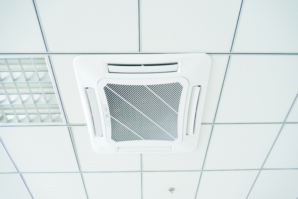 A durable Rinnai outdoor unit installed on a concrete base, featuring energy-efficient Rinnai Heat Mode for high-quality commercial air conditioning Gold Coast setups.