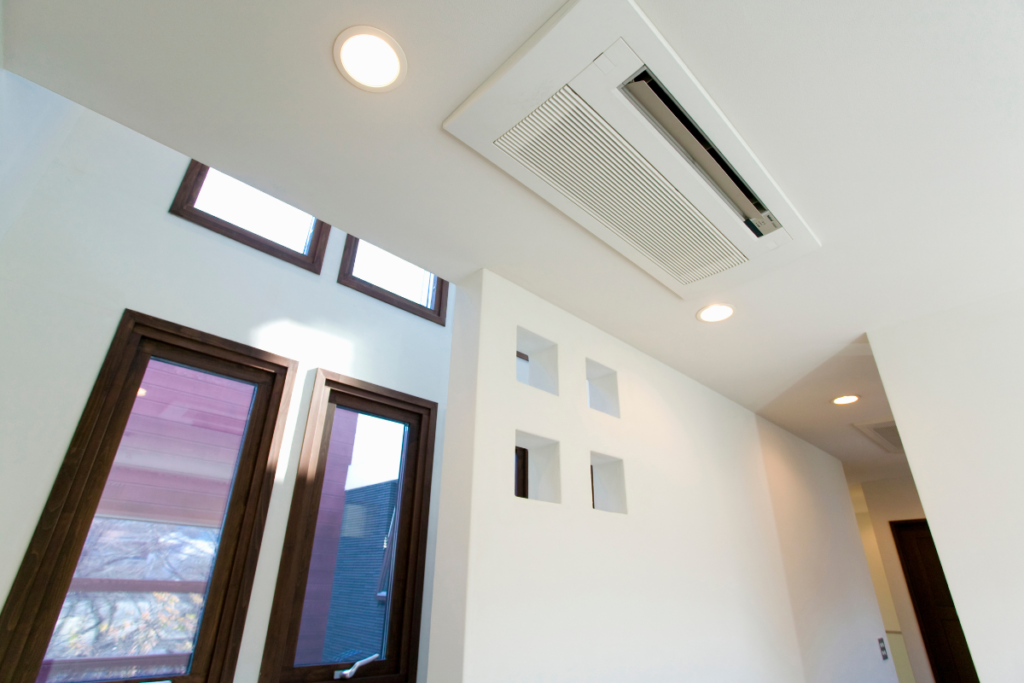 A sleek white Rinnai split system unit mounted on a wall, utilizing Rinnai Heat Mode to provide efficient residential air conditioning Gold Coast warmth during winter.