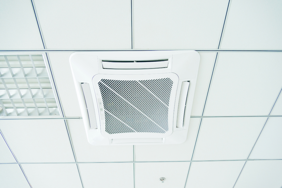 A durable Rinnai outdoor unit installed on a concrete base, featuring energy-efficient Rinnai Heat Mode for high-quality commercial air conditioning Gold Coast setups.