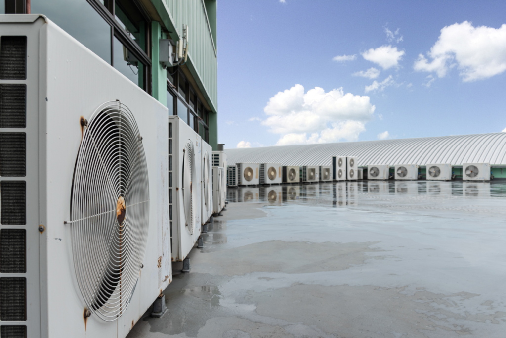 High-angle view of an extensive rooftop central climate network, illustrating the complexity of air conditioning gold coast setups requiring professional commercial VRV servicing Gold Coast programs and comprehensive VRV system maintenance.