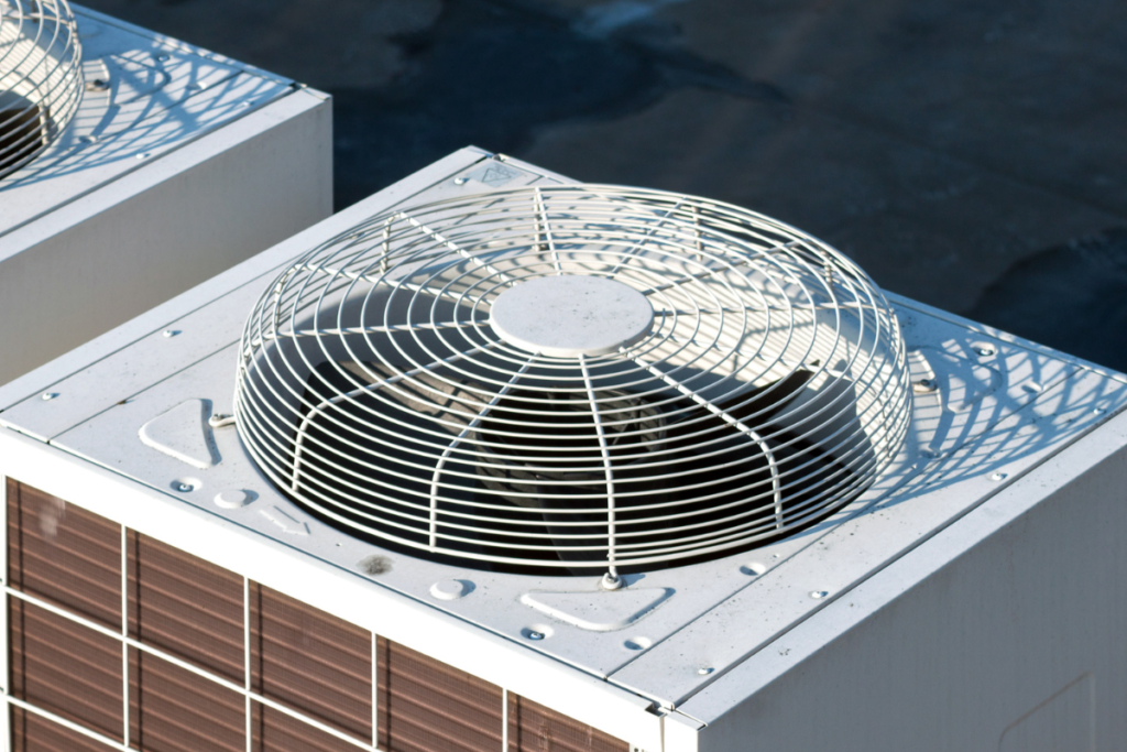 Close-up of heavy-duty industrial HVAC condensers arranged in rows, showcasing the prime hardware targeted during commercial air conditioning gold coast inspections, hotel HVAC maintenance, and proactive VRV system maintenance.