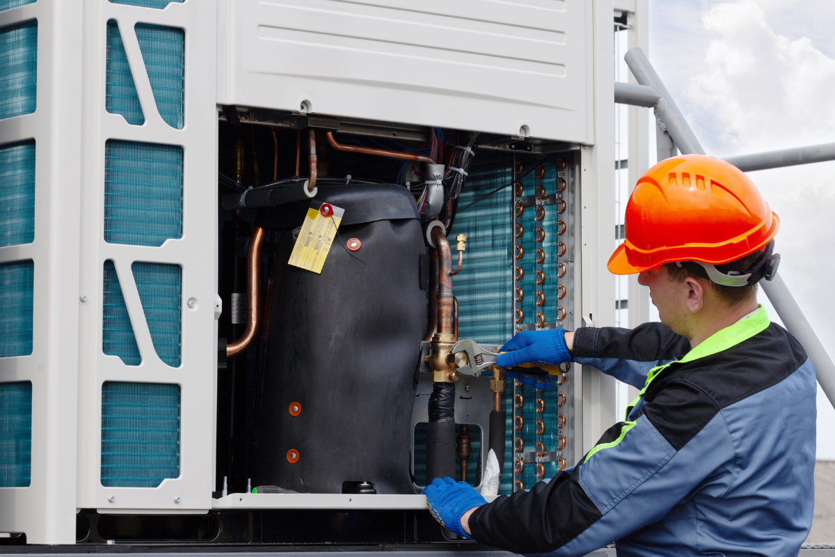 A side perspective of well-maintained commercial multi-system outdoor units on a rooftop, emphasizing the importance of scheduling regular commercial VRV servicing Gold Coast solutions alongside routine VRV system maintenance to support high-performing air conditioning gold coast systems.
