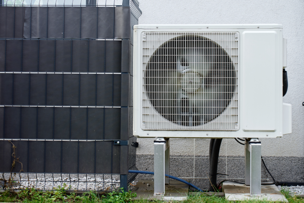 Clean and modern outdoor AC compressor unit, demonstrating the high-quality commercial air conditioning gold coast standards and proper air conditioning maintenance gold coast setup.