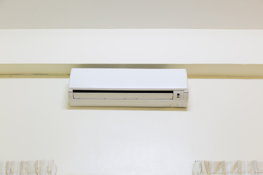 Commercial air conditioning Gold Coast ceiling cassette unit running in heating mode for office comfort.
