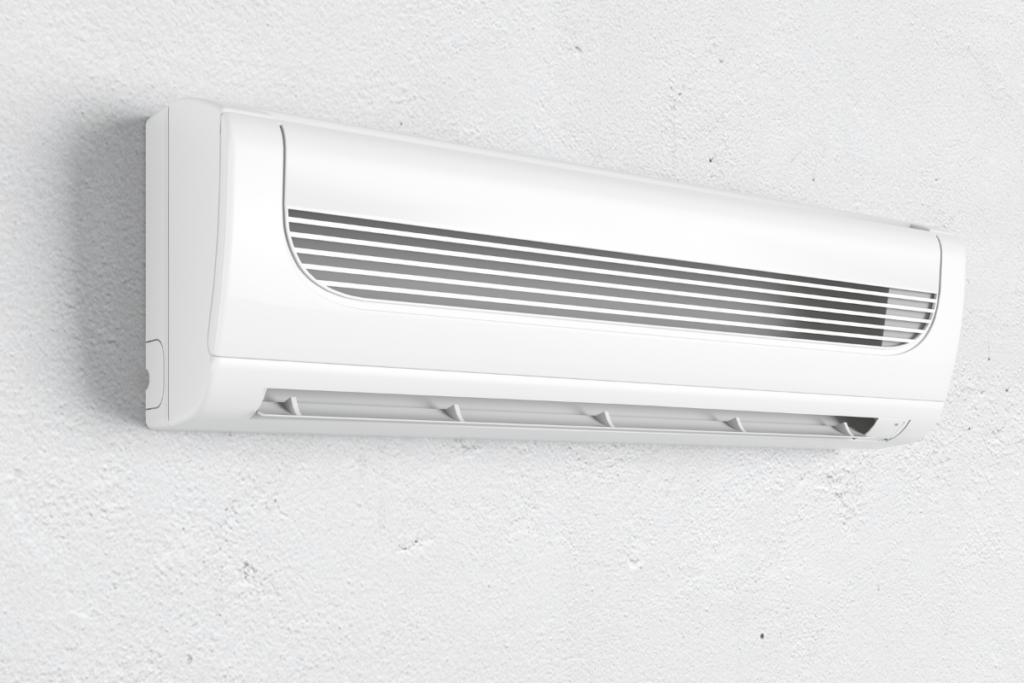 Close-up of an air conditioner unit in heating mode, comparing Mitsubishi Electric vs. Mitsubishi Heavy performance.