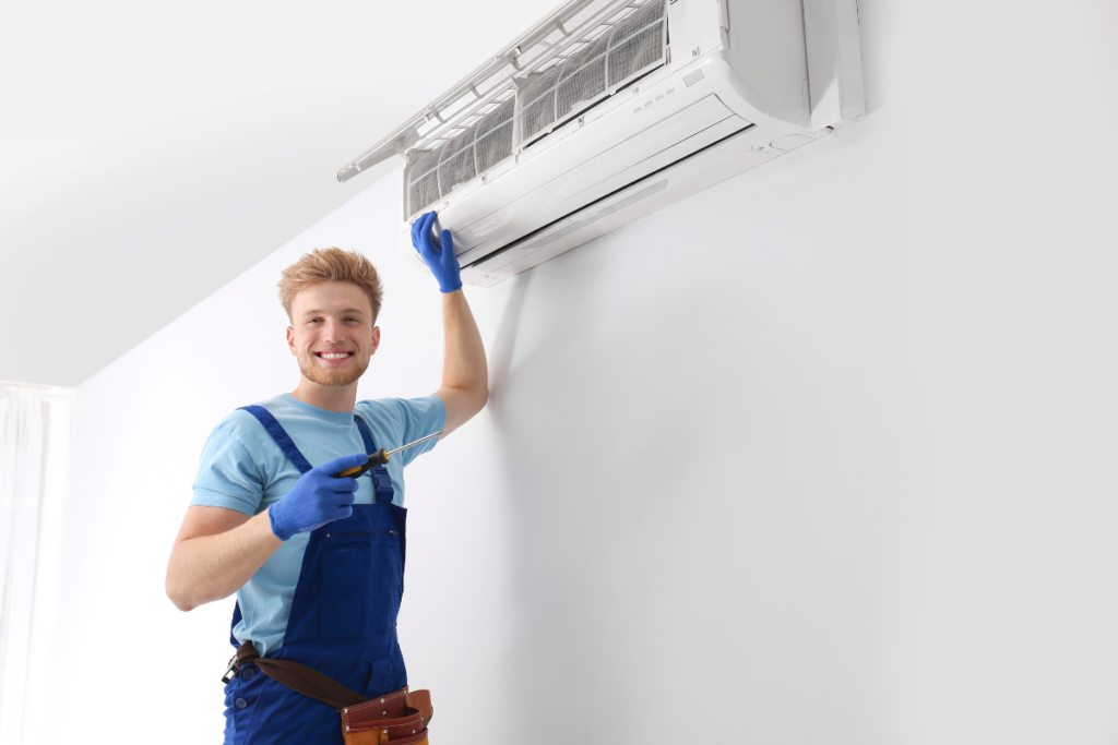 Professional technician inspecting indoor split system to maintain your AC with expert air conditioning maintenance Gold Coast service