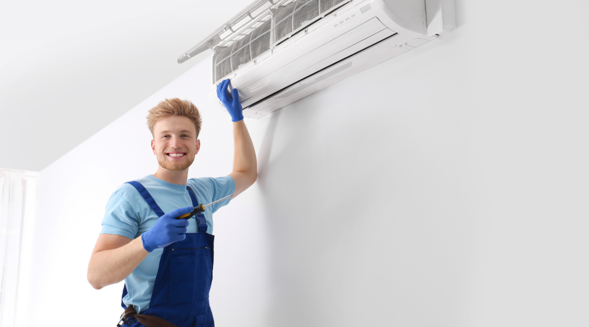 Professional technician inspecting indoor split system to maintain your AC with expert air conditioning maintenance Gold Coast service