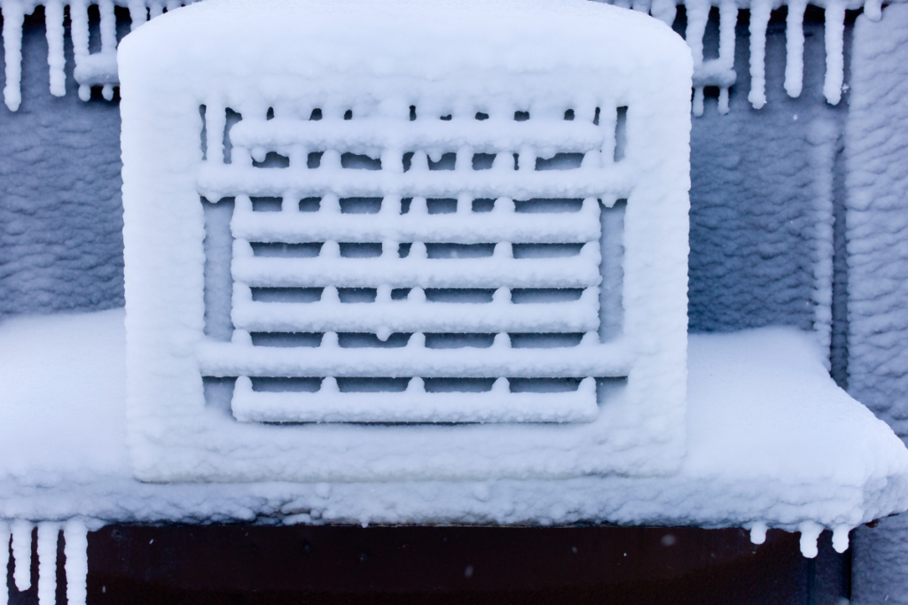 Close-up of an iced-over outdoor unit, illustrating a failure in residential air conditioning Gold Coast due to lack of ac maintenance in gold coast.
