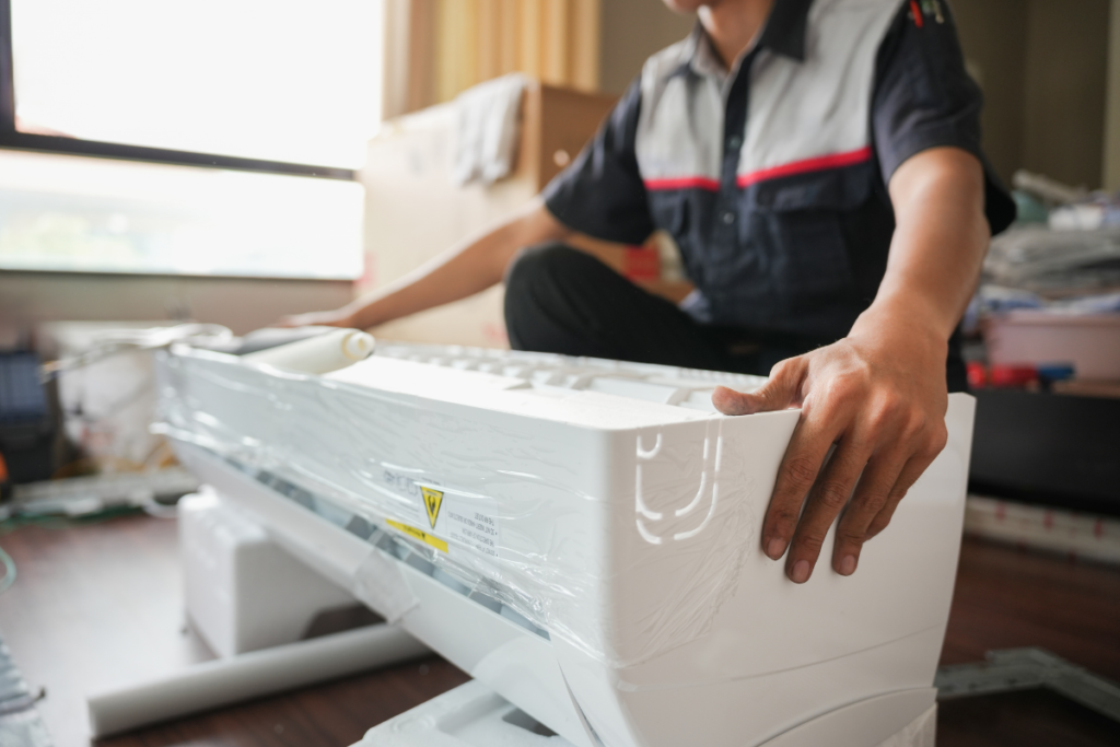 Professional technician performing hotel air conditioning installation for an EOFY equipment upgrade by a GENERAL Fujitsu authorised dealer.