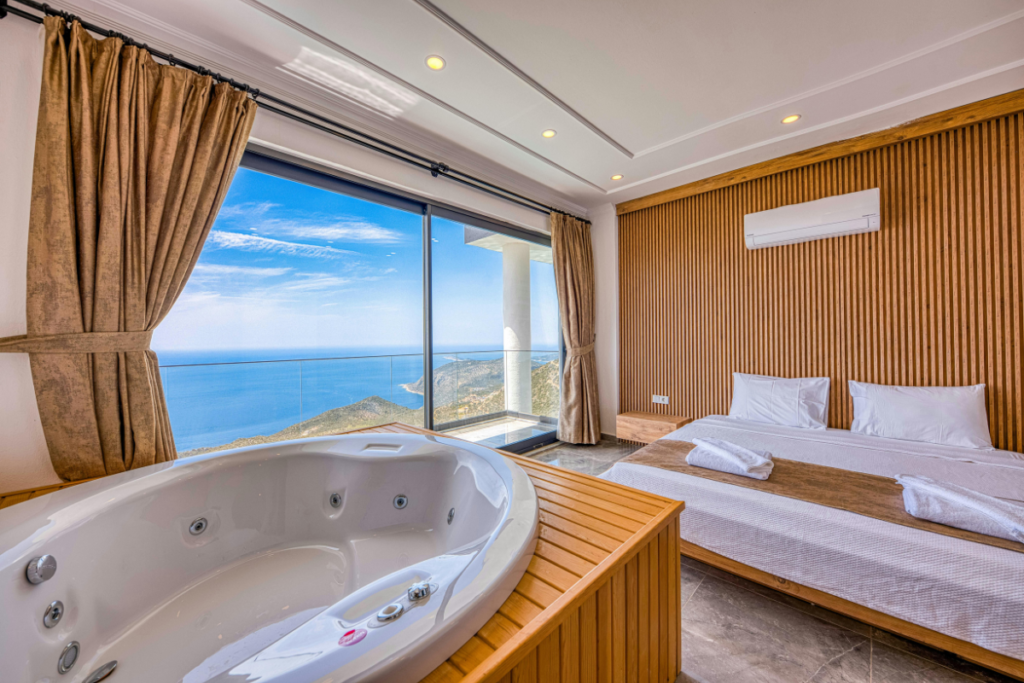 Fujitsu authorised dealer wall-mounted air conditioning unit in a sea-view hotel suite with a spa bath