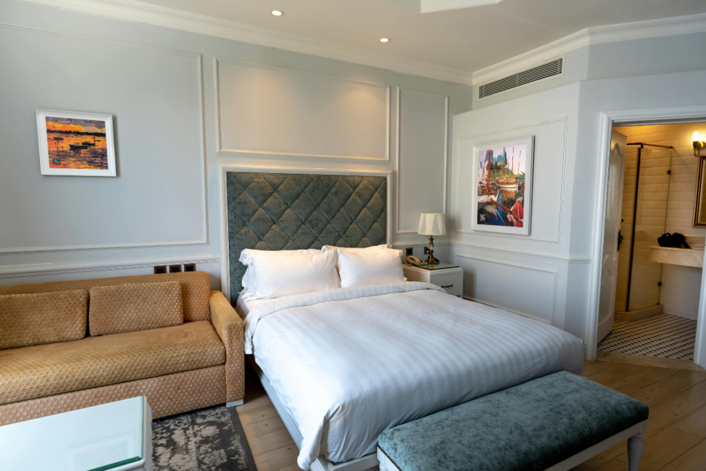 Commercial air conditioning installation Gold Coast with a ceiling supply vent in a bright coastal hotel room