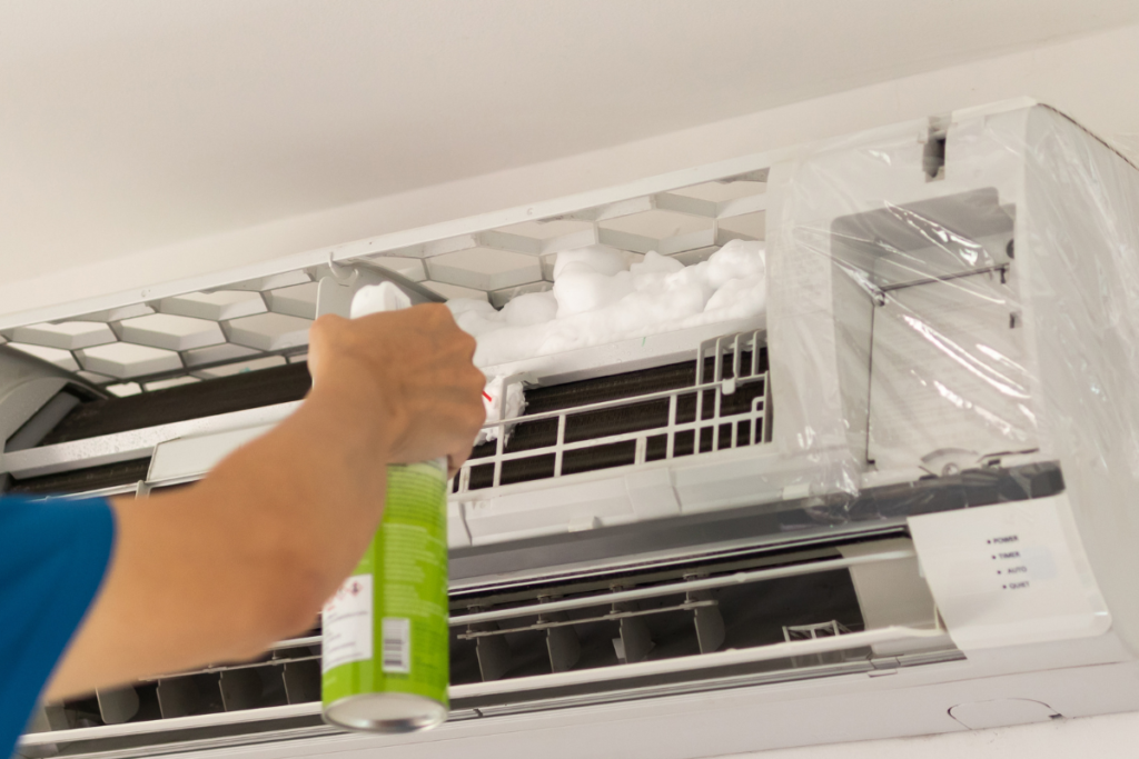 Hydro clean air conditioner service using specialised cleaning solution during a winter hydro clean to remove contaminants, support AC mould removal Gold Coast, and improve hotel indoor air quality.