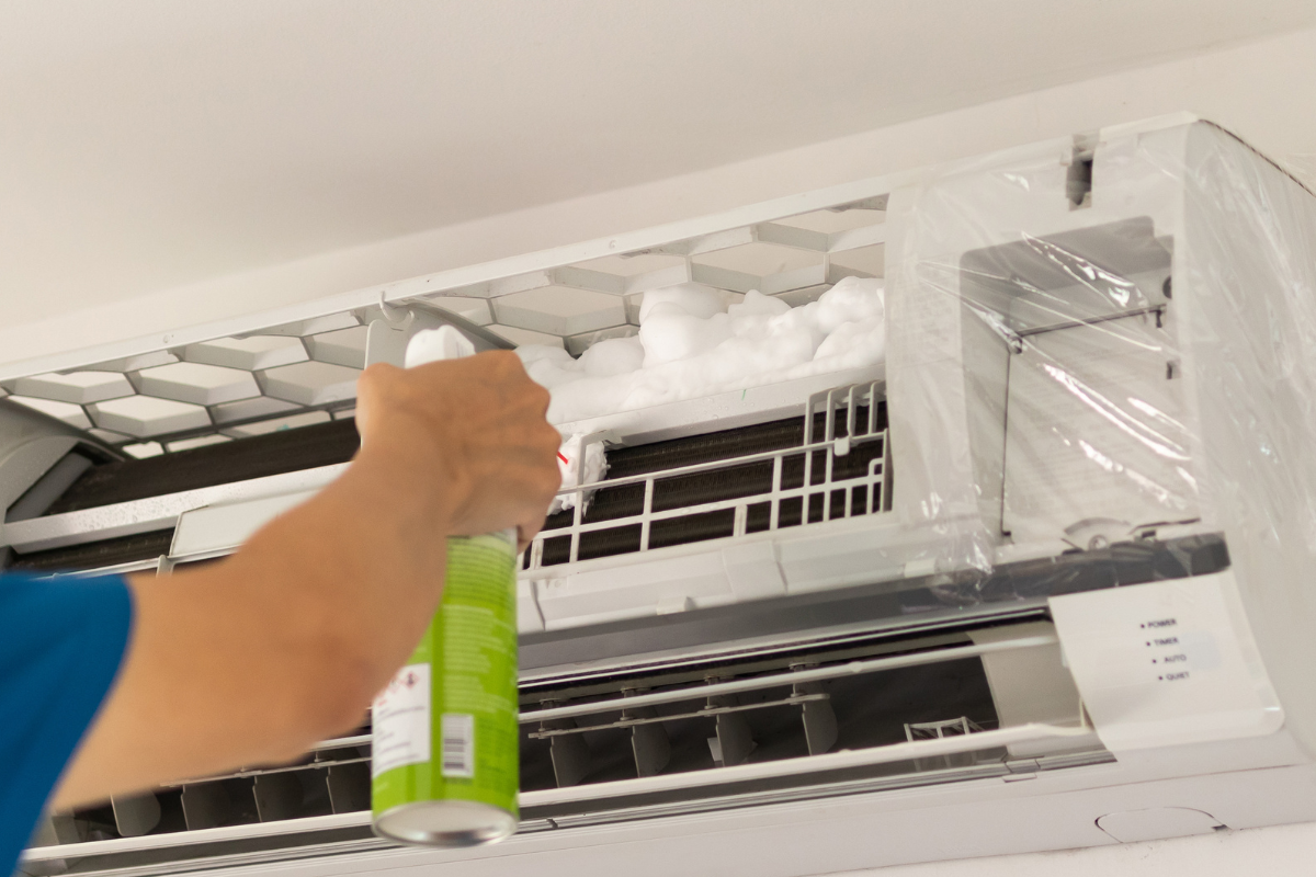 Hydro clean air conditioner service using specialised cleaning solution during a winter hydro clean to remove contaminants, support AC mould removal Gold Coast, and improve hotel indoor air quality.
