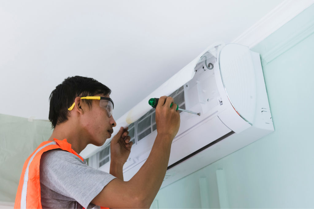 Licensed technician completing a commercial reverse cycle installation in an early learning room