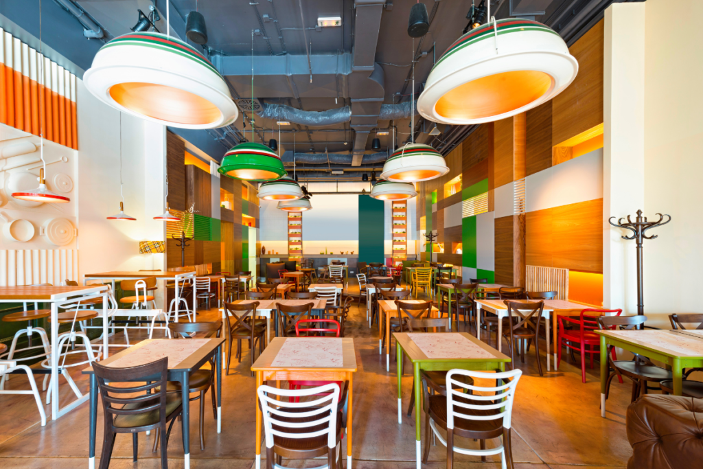 Ducted vs split system restaurant: colourful Gold Coast café with even air conditioning installation across the dining room
