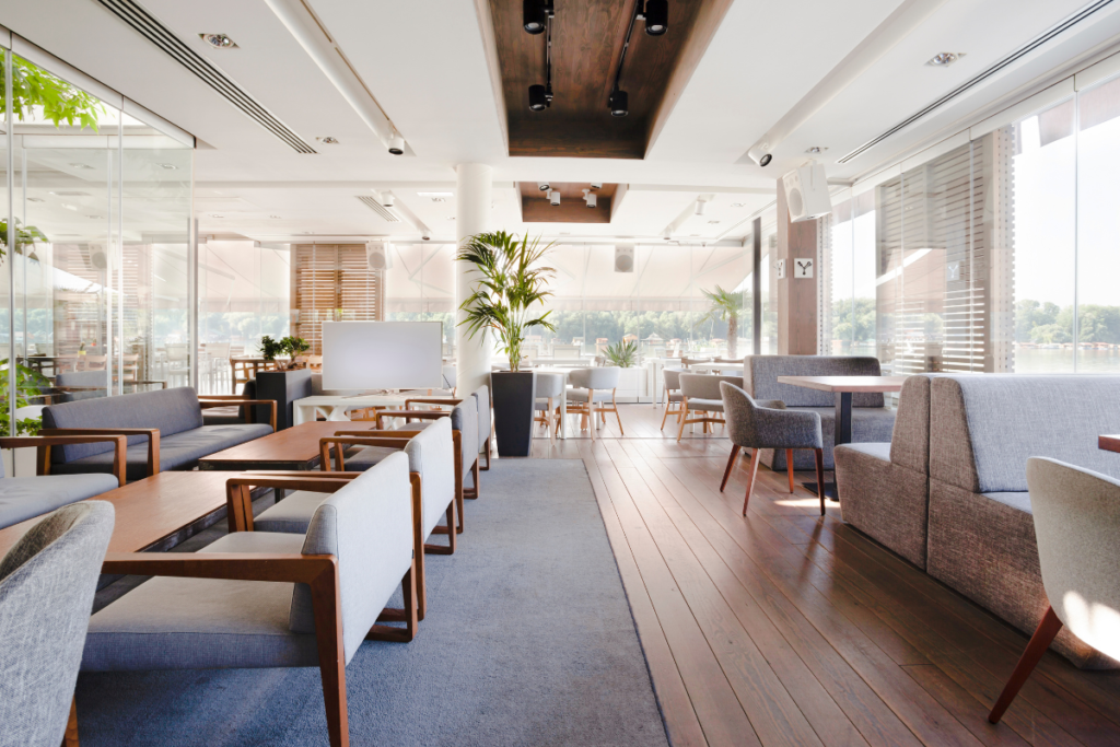 Hospitality HVAC Gold Coast: riverside restaurant lounge cooled by ceiling air conditioning with river views