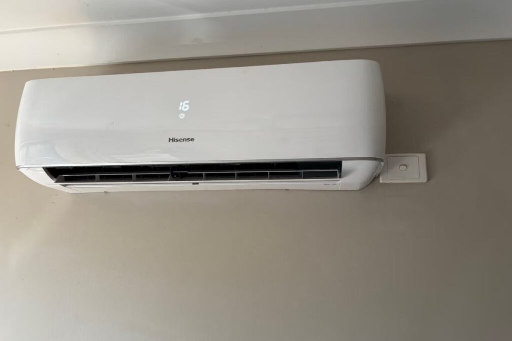 Hisense split system air conditioning installation Gold Coast on a Broadbeach home wall, set to 16 degrees