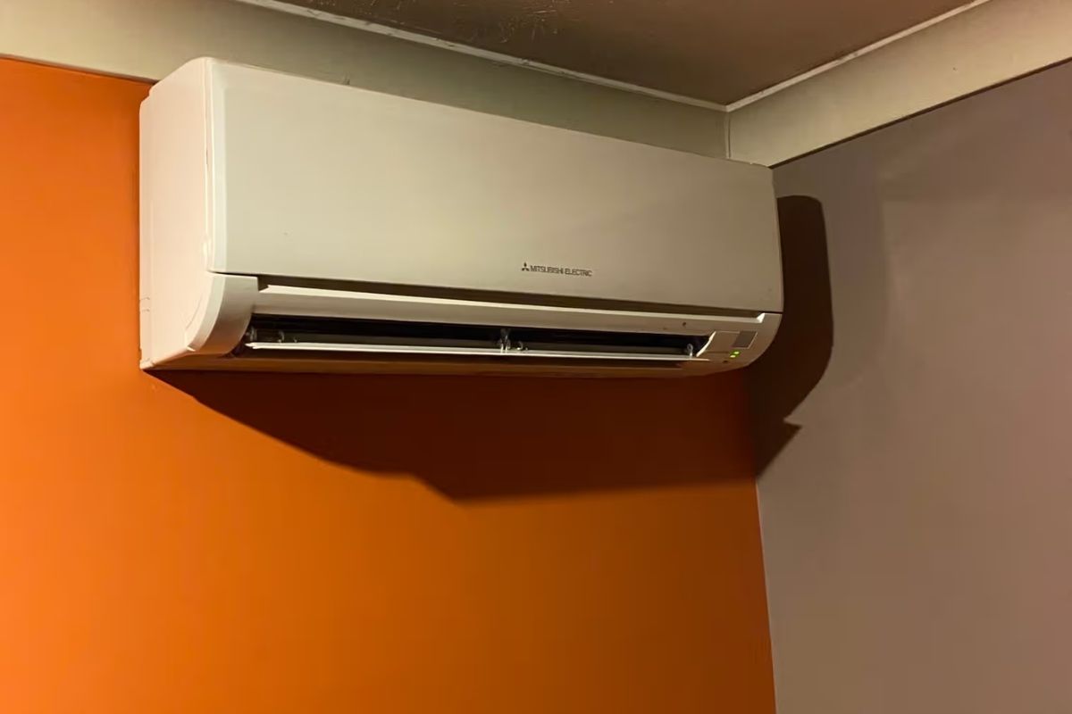 Wall-mounted split system showing signs AC is low on gas, running without cooling the room