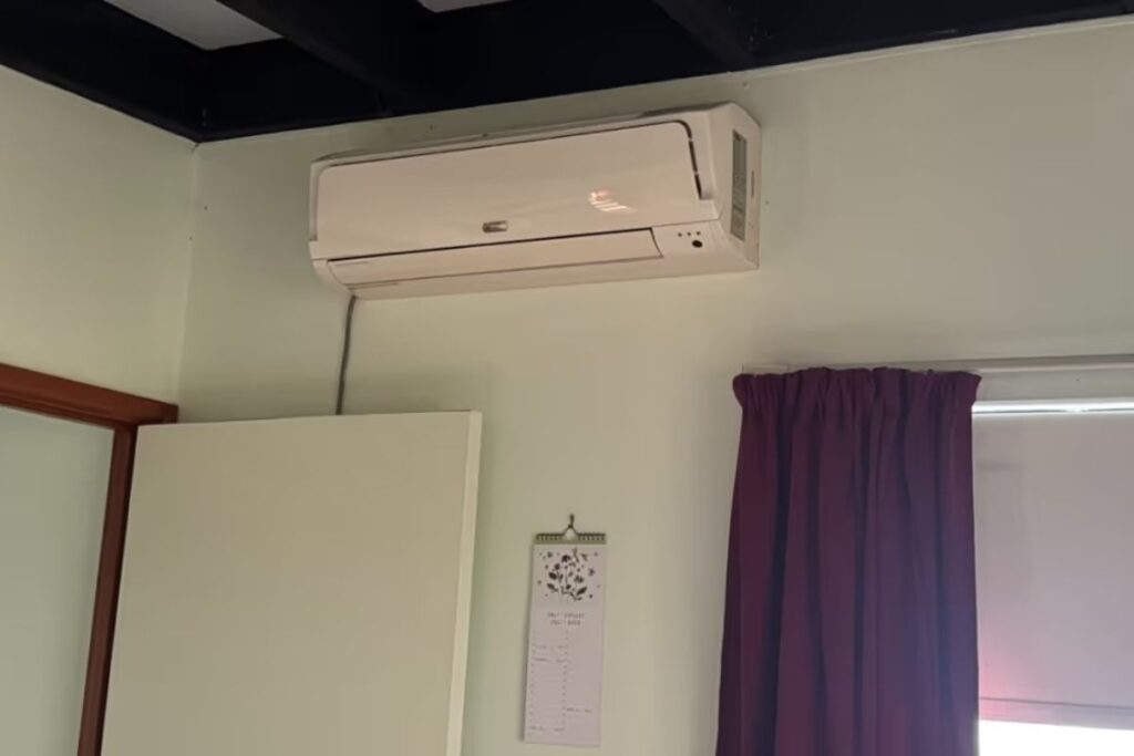 Wall-mounted split system in a Varsity Lakes bedroom — the best time to install air conditioning Gold Coast is before summer