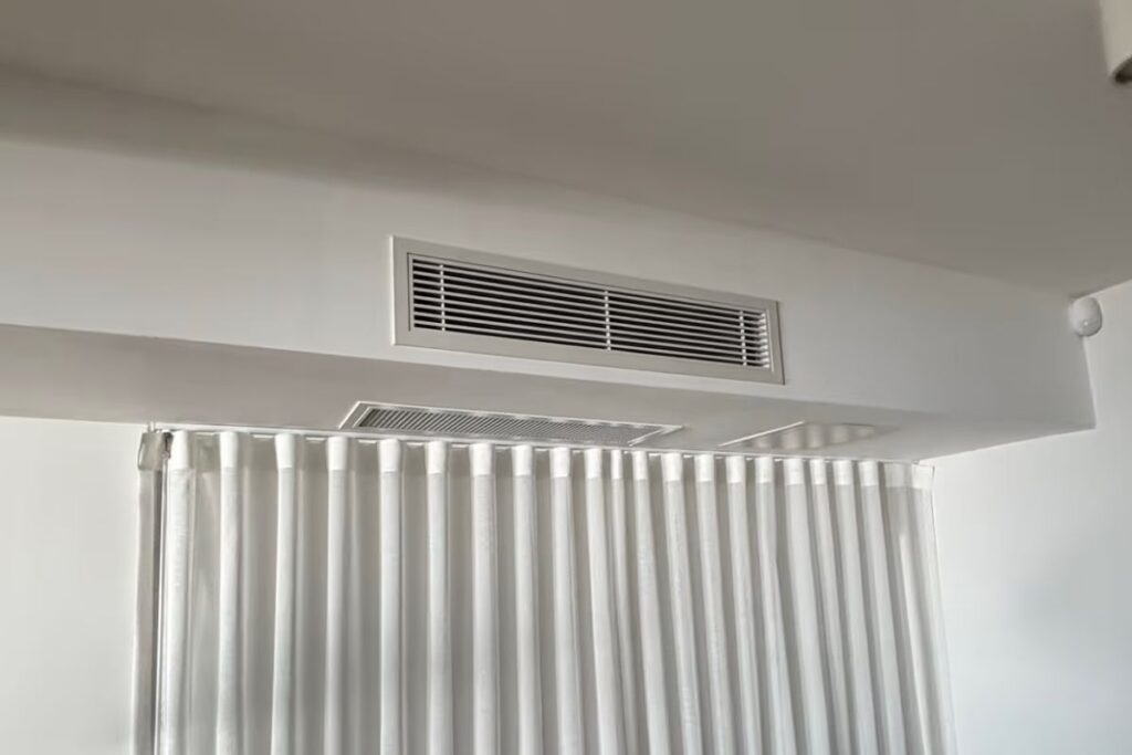 Ceiling ducted air conditioning vent in a Gold Coast home — the type that hides faults until the hot day that lands you in the queue.