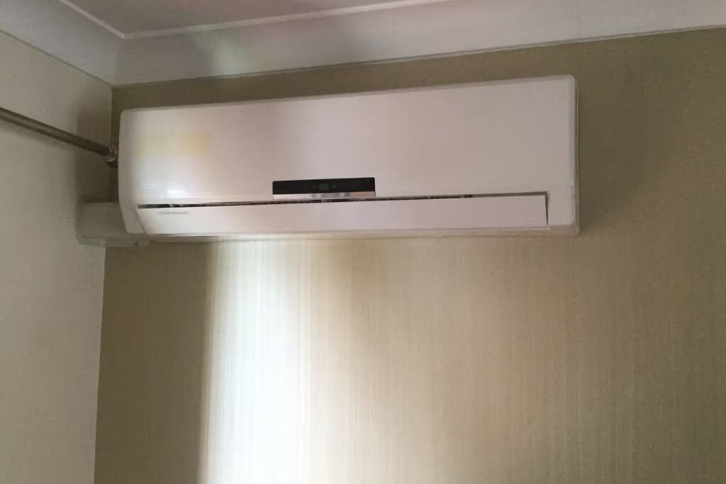 A clean-looking wall-mounted unit that seems fine outside, requiring air conditioner service Burleigh Heads to catch hidden internal issues.