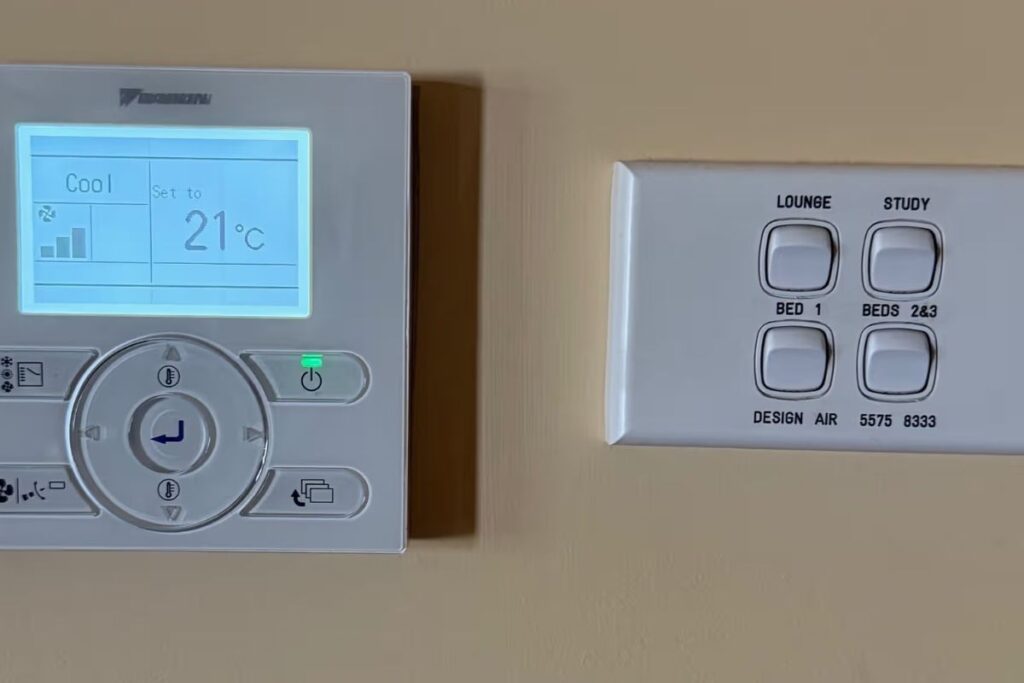 Daikin wall controller in cool mode at 21°C — voice control aircon zones like the lounge, study and bedrooms hands-free.