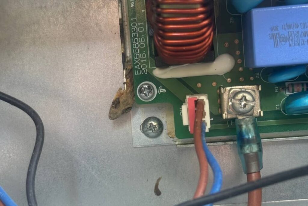 Corrosion and geckos remain beside an aircon control board — geckos in aircon can make the unit trip