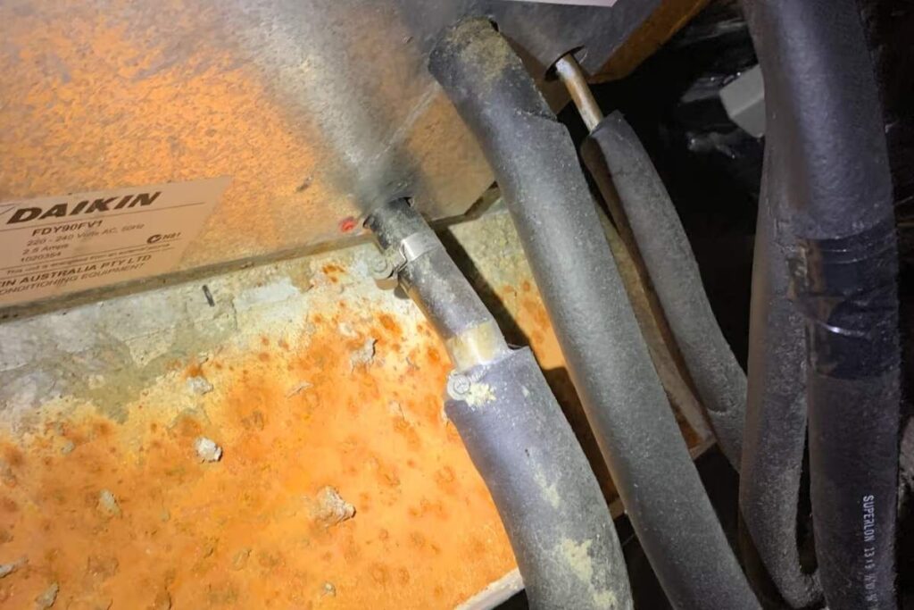 Rusted Daikin ducted unit casing and copper lines needing air conditioning hydro clean and repair Gold Coast