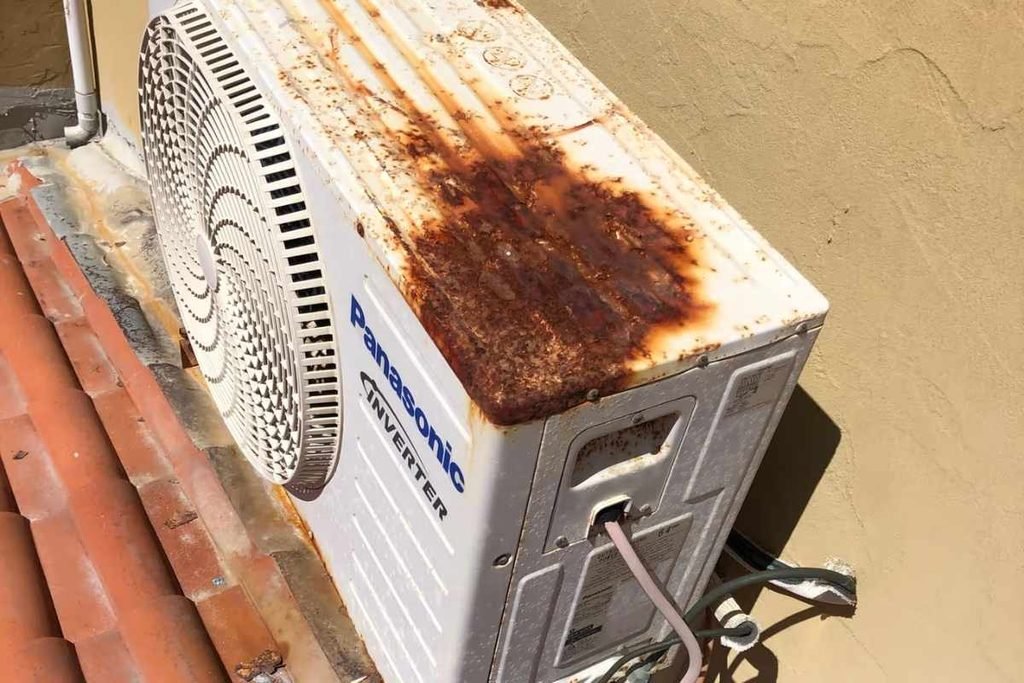 Heavily rusted Panasonic aircon on a Gold Coast roof needing an air conditioning repair or upgrade