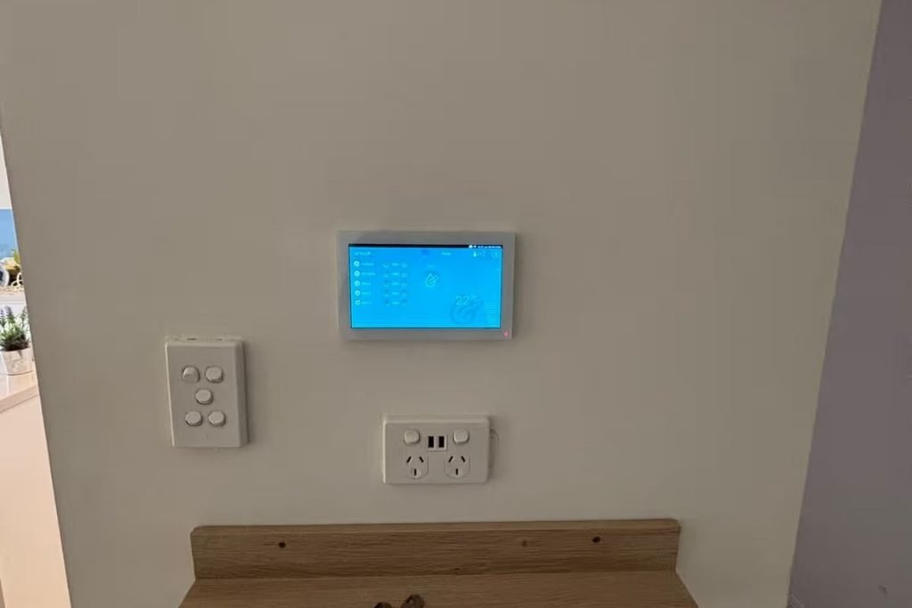 AirTouch screen mounted on a wall next to light switches, checked when AirTouch is not working