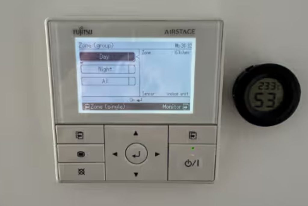 Fujitsu Airstage wall controller showing day and night zones for ducted air conditioning