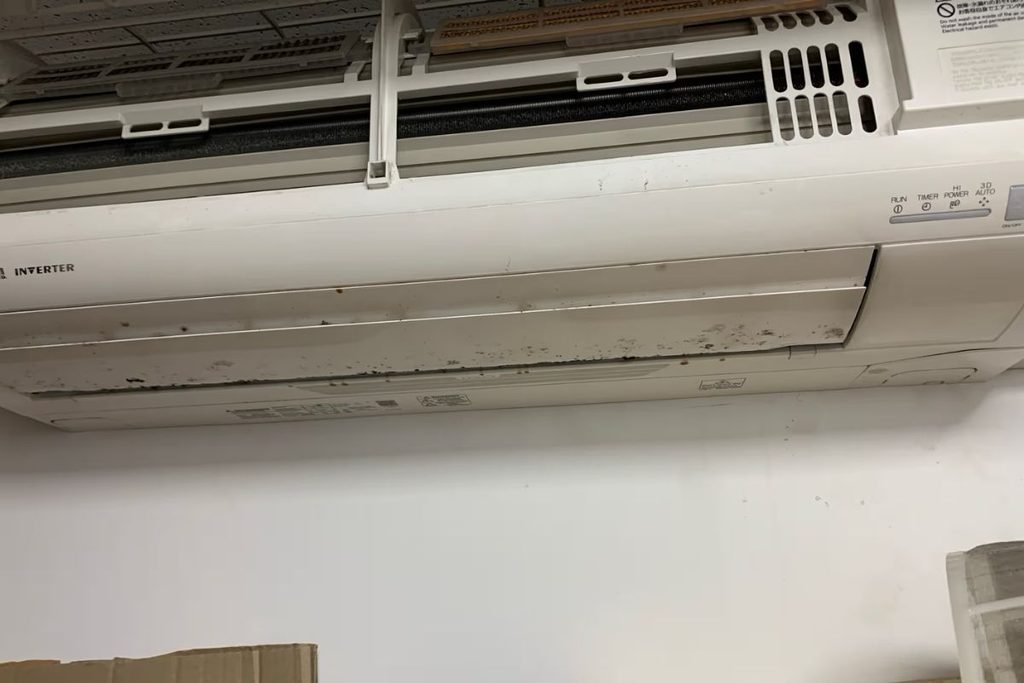 Mould spotting on a split system casing, a clear sign the air conditioner smells musty