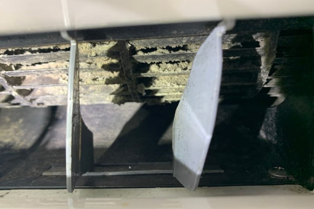 Clogged coil fins restricting airflow, a common air conditioning Gold Coast maintenance problem
