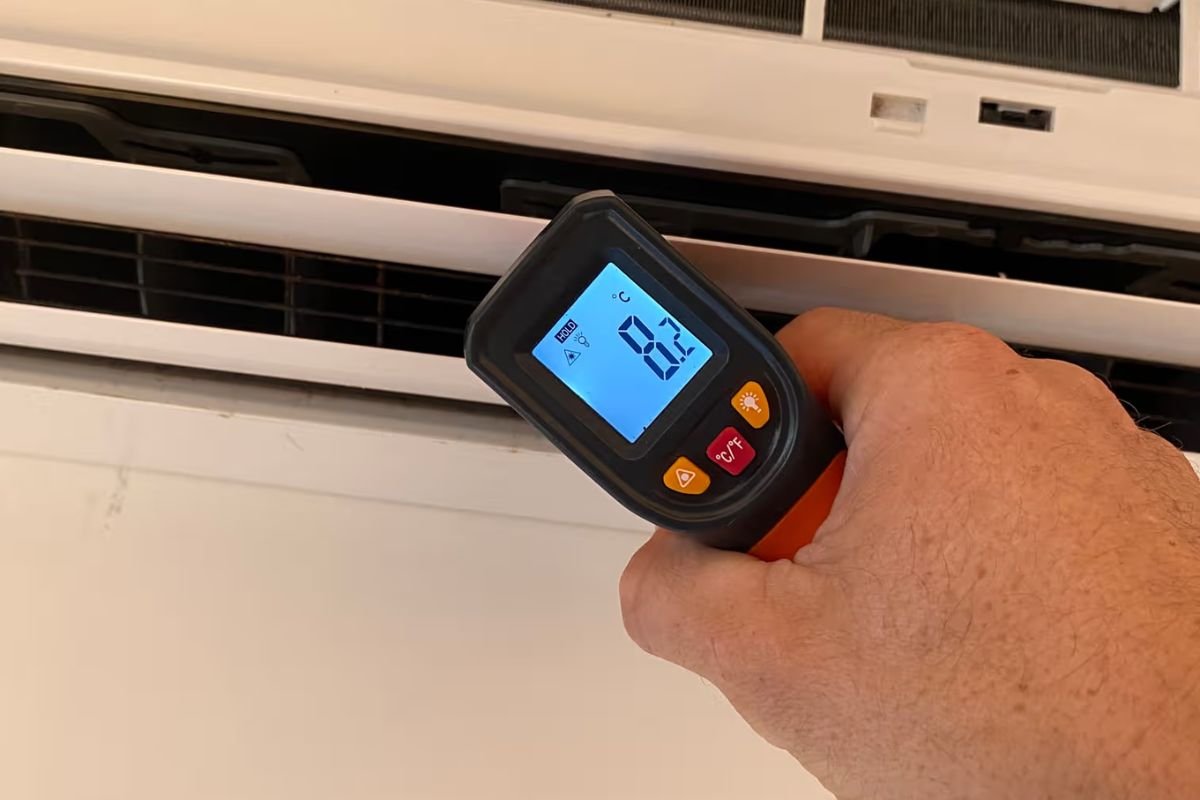 Testing outlet air temperature to see if a split system needs a gas recharge on the Gold Coast