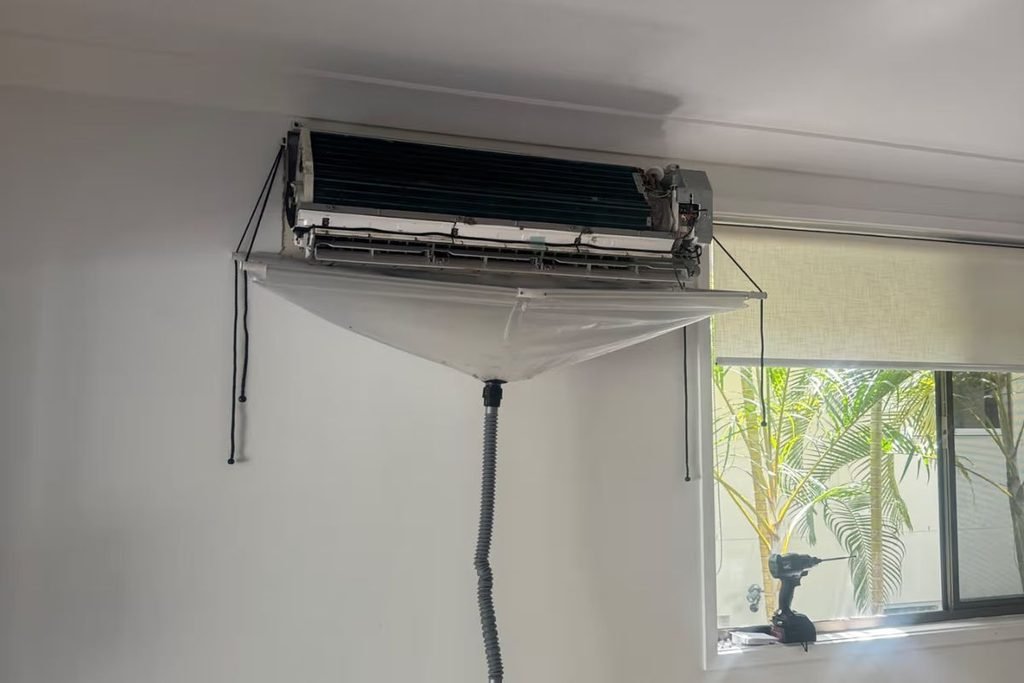 Hydro clean of an indoor unit during air conditioning repair on the Gold Coast