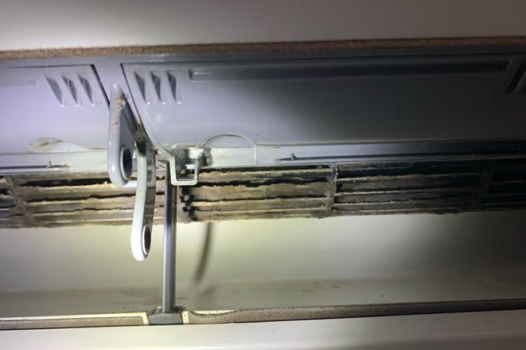 Close-up of a dirty coil and mould build-up that can cause a split system dripping water