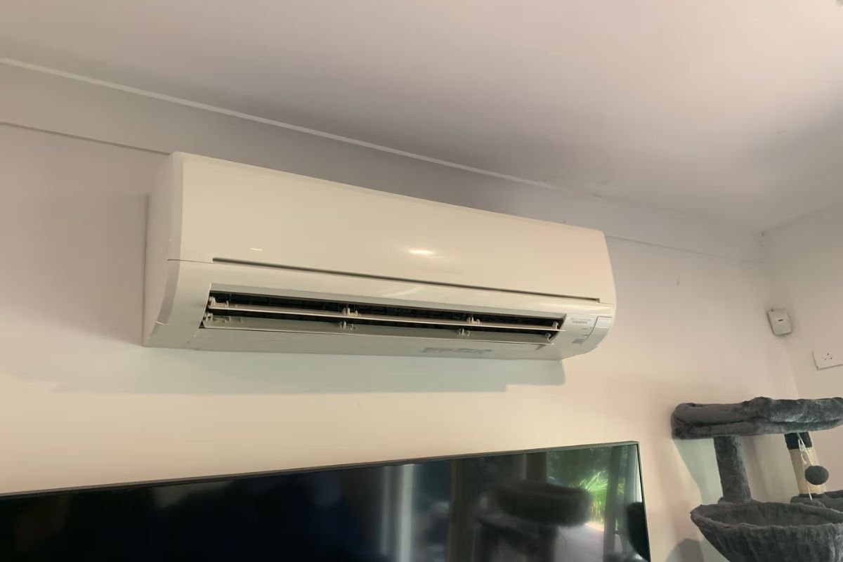 Mitsubishi Electric split system above a TV after air conditioning repair Gold Coast