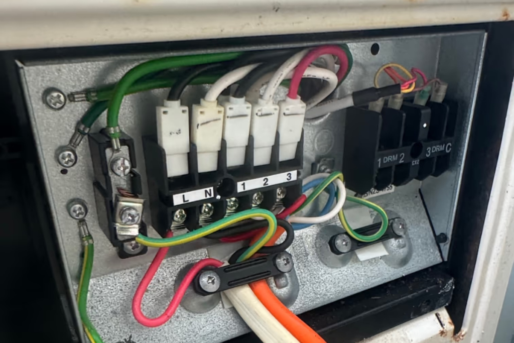 Wiring terminals checked during air conditioning repair Gold Coast when AC keeps shutting off