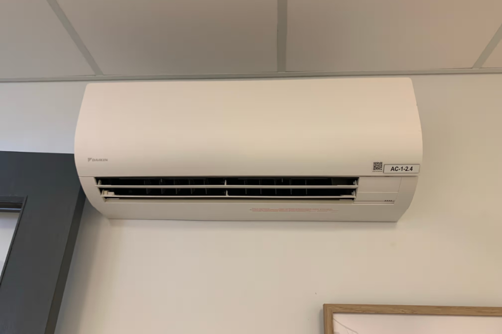 Daikin split system air conditioner in a Gold Coast office, set to handle spring temperature swings